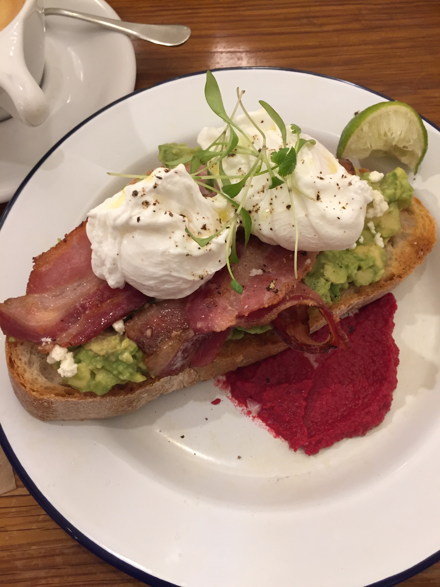 the smashed avocado on toast with poached eggs and maple bacon