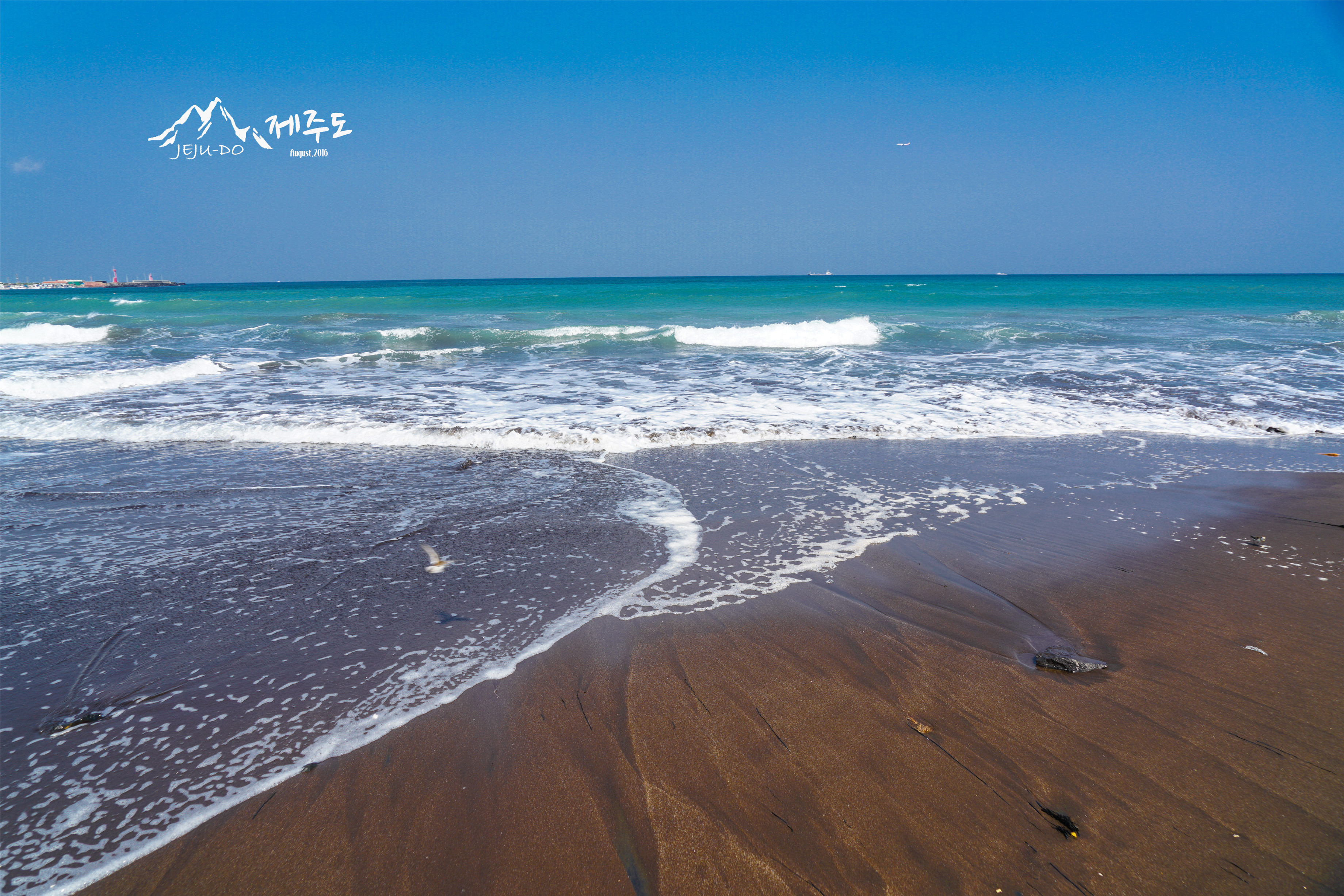 三阳黑沙海滨浴场图片